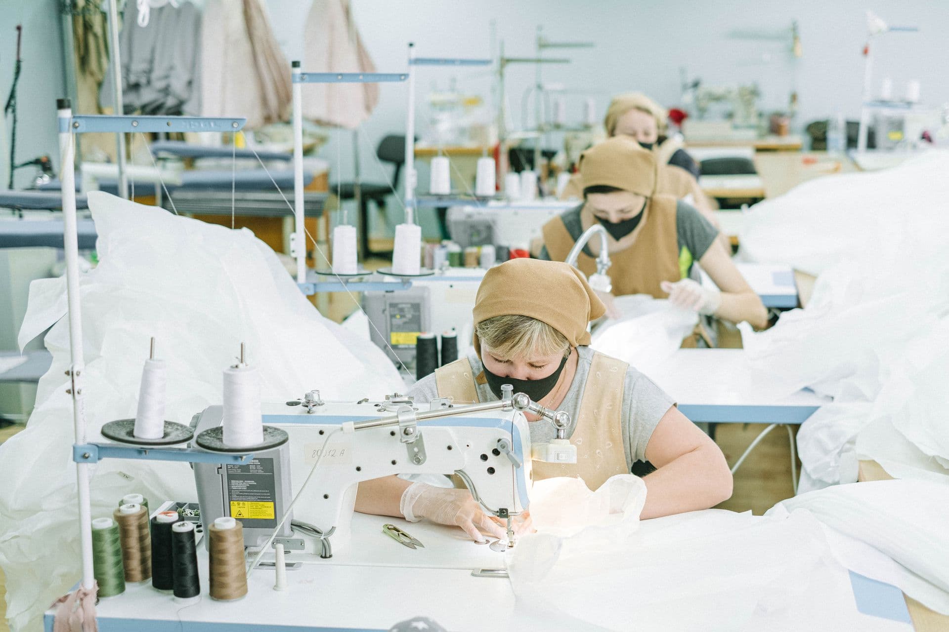 Sample room with thread spools and sewing stations
